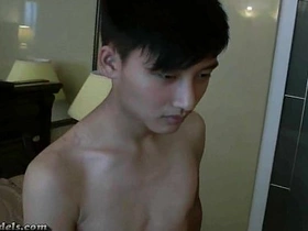 Asian guys masturbate and cum together in the shower