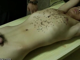 Asian boy's fit body receives sensual hot wax massage